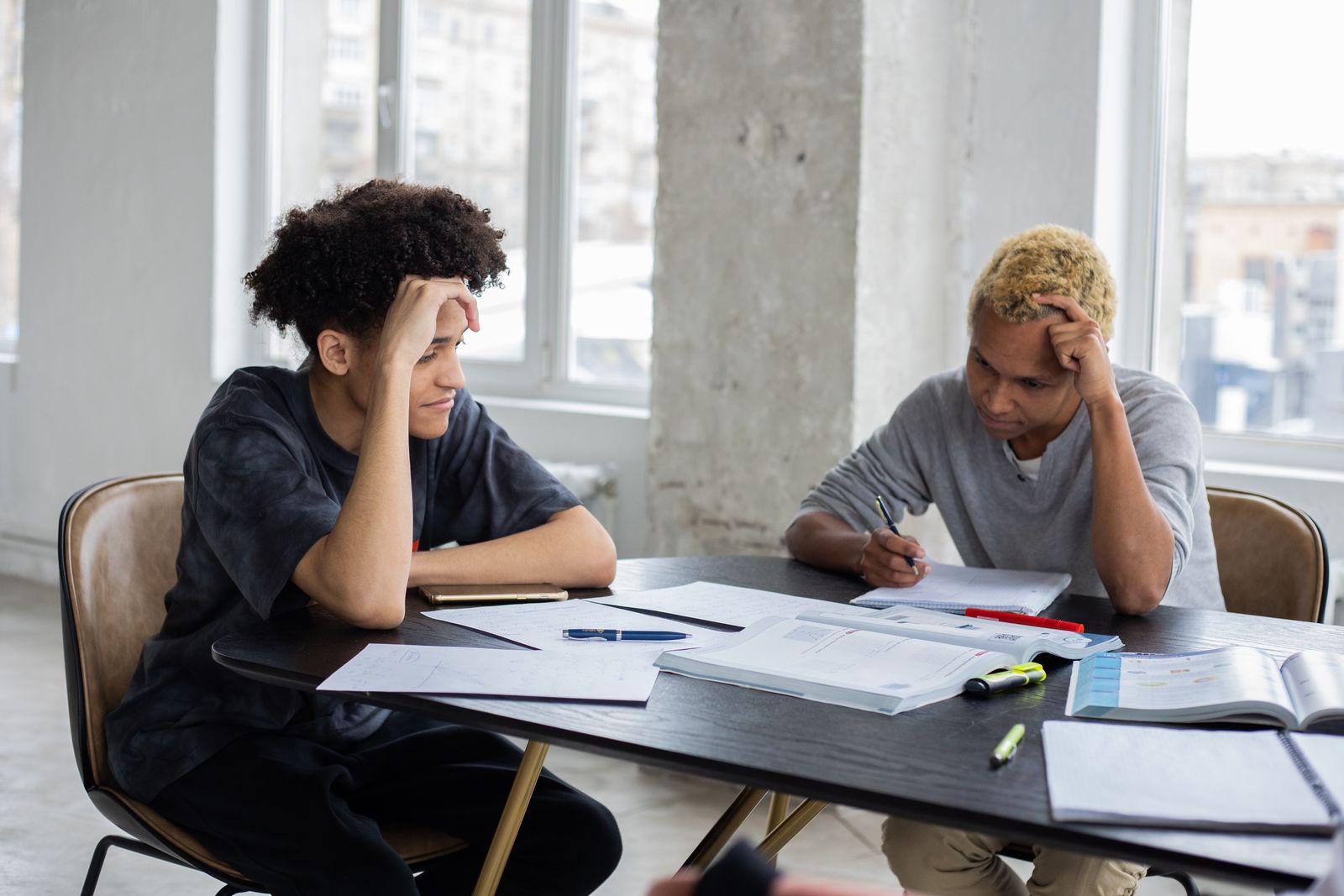 Two students studying together at a table